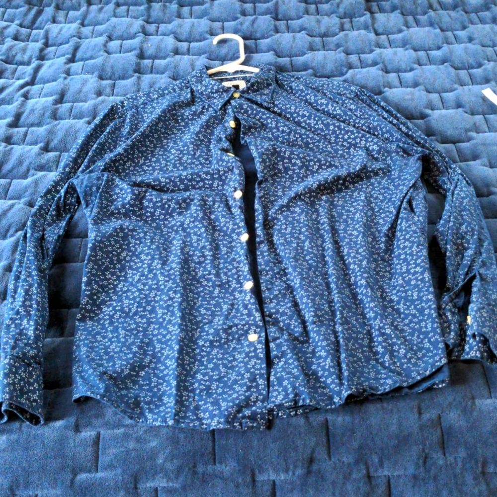 Blue button-down shirt with tiny white Hibiscus print